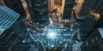 An aerial drone shot of a financial district at dusk, with glowing digital market data lines overlaying the city's geometric patterns, illustrating the connection between global news and personal finance.